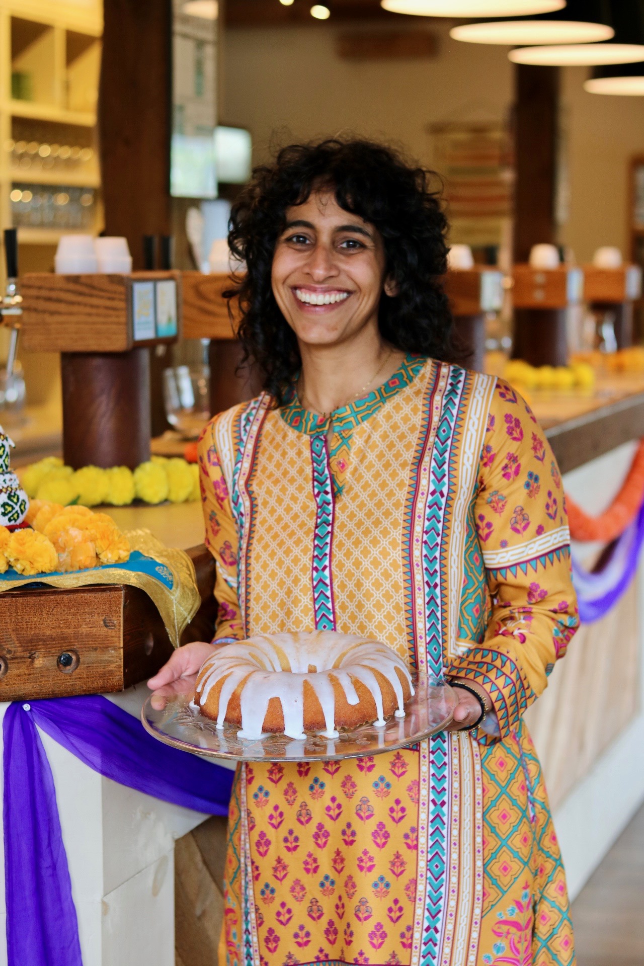 Naz Pasternak with Navroz cake, photo credit Alex Pasternak