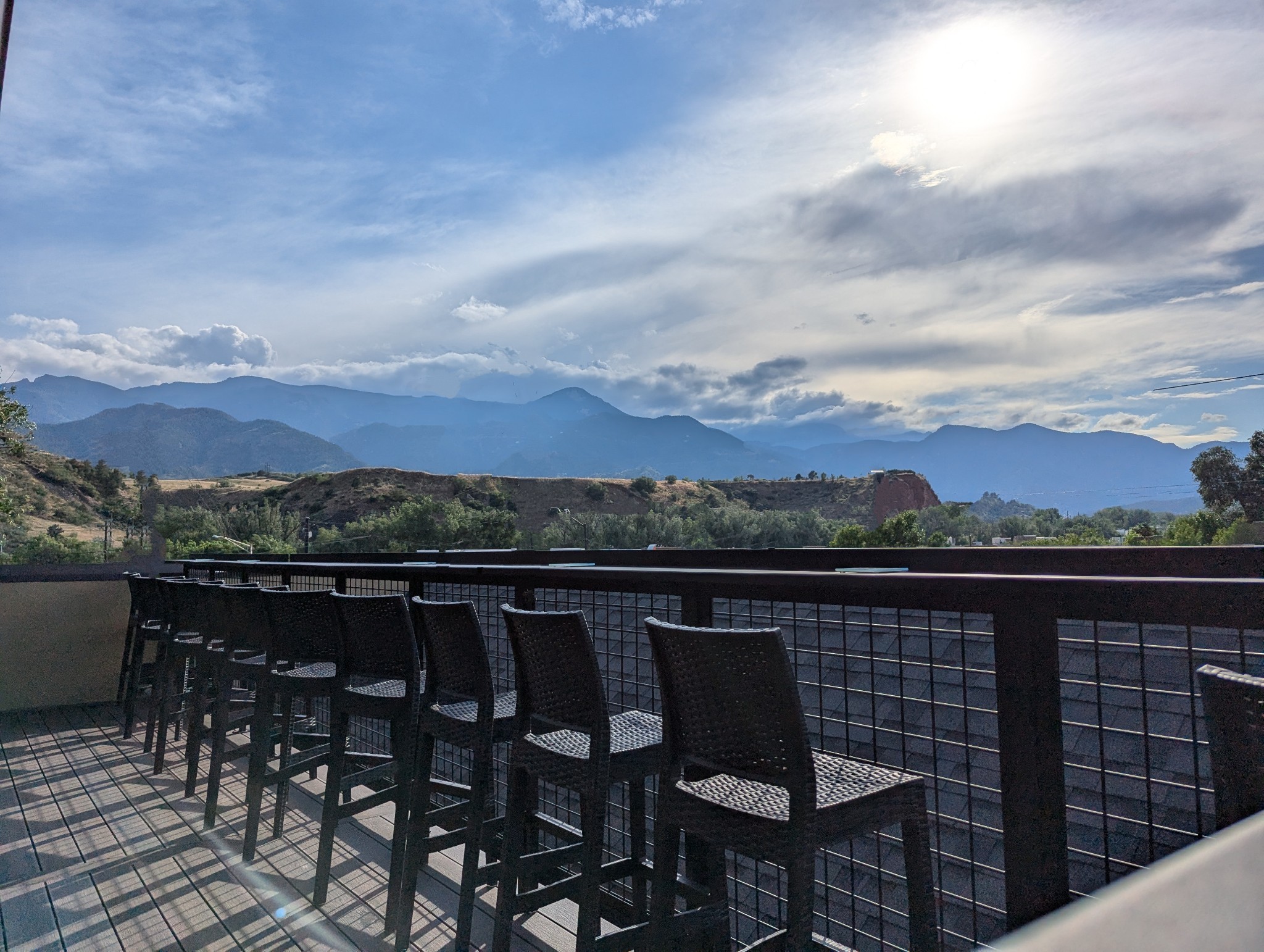 View from WestFax Springs rooftop patio, facing Cheyenne Mountain on the Front Range